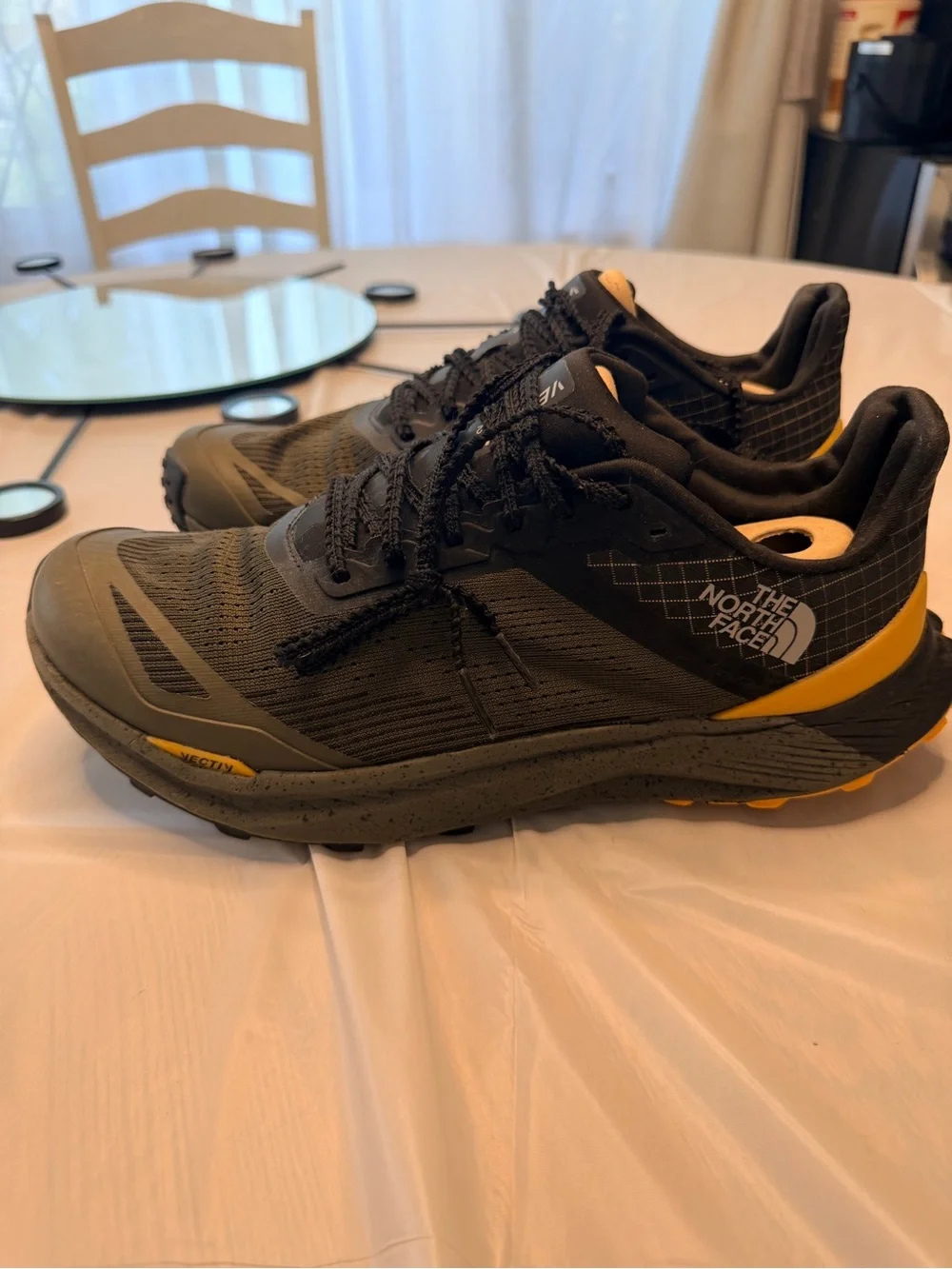 The North Face Men's Black and Olive Trail Shoes with Yellow and Red Accents